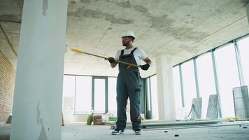 Indian Builder Worker Using Roller on Construction Site Walls video