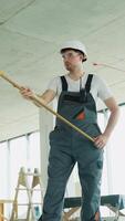 Builder Applying Wall Coating with Roller in Renovation Project video