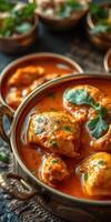 Rich and flavorful chicken curry served in traditional bowl garnished with fresh herbs photo