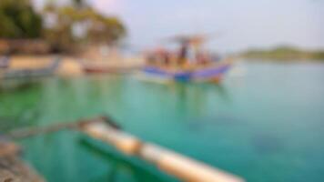 Abstract Blurred Background, Tropical Beach with Boats and Turquoise Water photo
