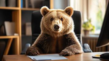 Bear sitting at a desk in an office environment photo