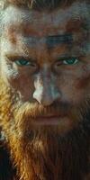 Intense gaze of a rugged warrior with a majestic beard outdoors photo