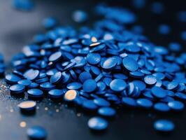 Bright blue circles on a dark surface create a striking visual photo