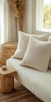 Cozy living room corner with textured pillows and natural decor elements photo