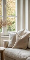 Cozy living room corner with soft pillows and serene outdoor view photo