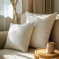 Cozy living room with soft pillows and wooden accent table during daytime photo