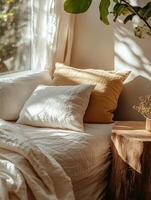 Cozy bedroom with natural light filtering through window during morning photo
