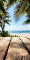 Relaxing beach view with wooden table in tropical paradise photo