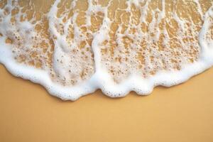 Waves gently break on a sandy beach during sunset in warm tones photo