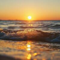 Sunset over the ocean waves creating shimmering reflections on the water photo