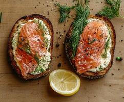 Delicious open-faced sandwiches with smoked salmon and fresh dill photo