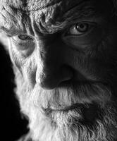 Intense close-up of an elderly man's expressive face in black and white photo