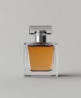 Elegant fragrance bottle with amber liquid on neutral background photo
