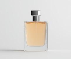 Elegant clear glass perfume bottle filled with light amber fragrance liquid photo
