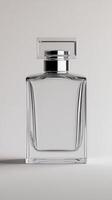 Elegant clear glass perfume bottle with minimalistic design on light background photo