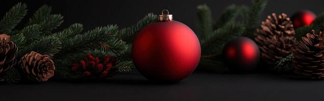 Beautiful red Christmas ornaments with pinecones and greenery decorations photo