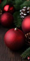 Red Christmas ornaments and pinecones create a festive holiday atmosphere photo