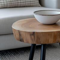 Elegant wooden coffee table with a simple bowl on top in a modern living room photo
