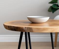Stylish wooden table with a minimalist white bowl in modern interior design photo