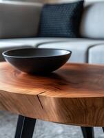 Modern wooden coffee table with black bowl in an elegant living room setting photo