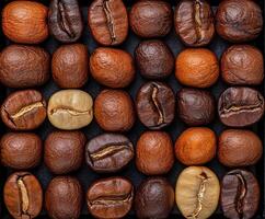 Variety of coffee beans arranged in a geometric pattern on dark background photo