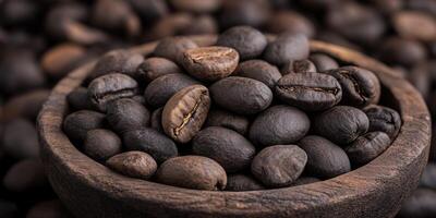 Freshly roasted coffee beans in a rustic wooden bowl on a dark background photo