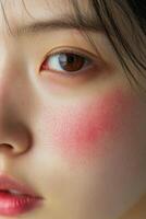 Close-up of a young woman with natural blush highlighting her features photo