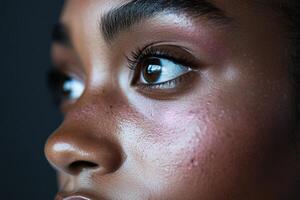 Captivating close-up of a young person's expressive eyes and skin details photo