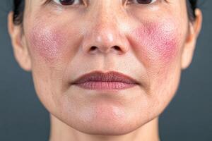 Close-up of a woman's face highlighting skin texture and natural blush photo