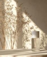 Elegant glass bottle and dried flowers in soft light create serene atmosphere photo