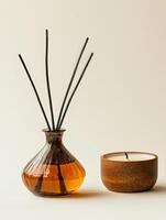 Decorative aroma diffuser and candle against a light background photo