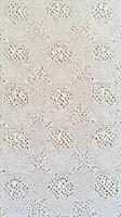 Intricate white lace fabric showcasing delicate patterns and textures photo