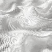 Delicate white fabric with intricate texture captured in soft lighting photo