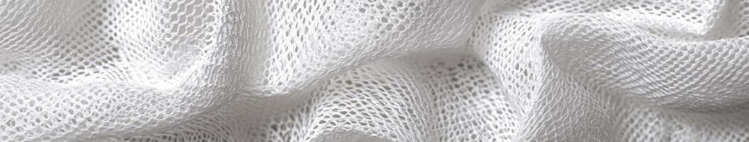 Soft white fabric draping elegantly in natural light photo