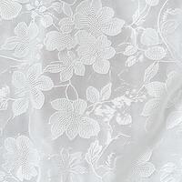 Delicate white floral lace fabric with intricate patterns on display photo