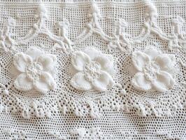 Crochet lace design featuring floral motifs and intricate patterns photo