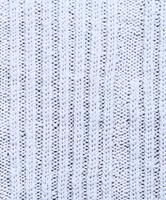 Soft white knitted fabric showcasing intricate patterns and textures photo
