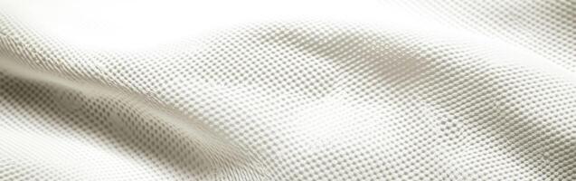 Textured white fabric showing subtle weaves and patterns in soft light photo
