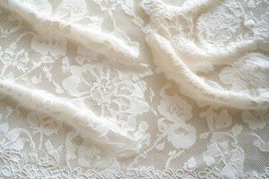 Delicate floral lace fabric draped elegantly in soft light photo