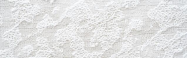 Elegant white lace fabric with intricate patterns and textures photo