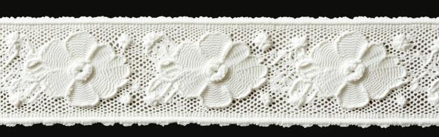 Decorative lace trim with floral patterns on a black background photo