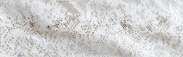 Beautiful intricate white lace fabric with detailed patterns and textures photo