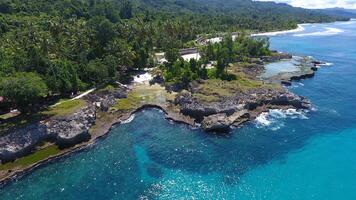 view of the coral rocks on the edge of West Papua's Biak beach as seen from above photo