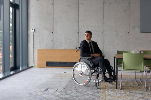 A director in a wheelchair sitting alone in an empty office, deeply reflecting on business strategies and decisions, contemplating the path forward with focused determination. photo