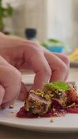 Chef is Plating Second Course of Tuna Gratinated with Caramelized Onions video