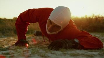 Suffocating Astronaut Crawls Lying On The Ground In Planet With Toxic Atmosphere video