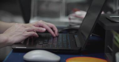 Close up person working on laptop, hands of man typing on keyboard. video
