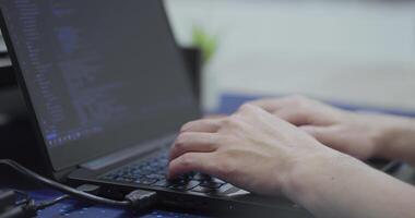 Close up person working on laptop, hands of programmer typing on keyboard. video
