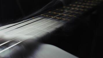 A Single String is Missing on Classic Guitar in Smoke Ambiance video