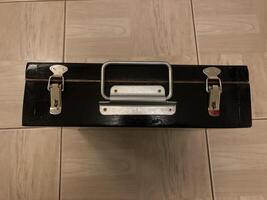 Black suitcase for documents with a steel handle and locks, top view photo